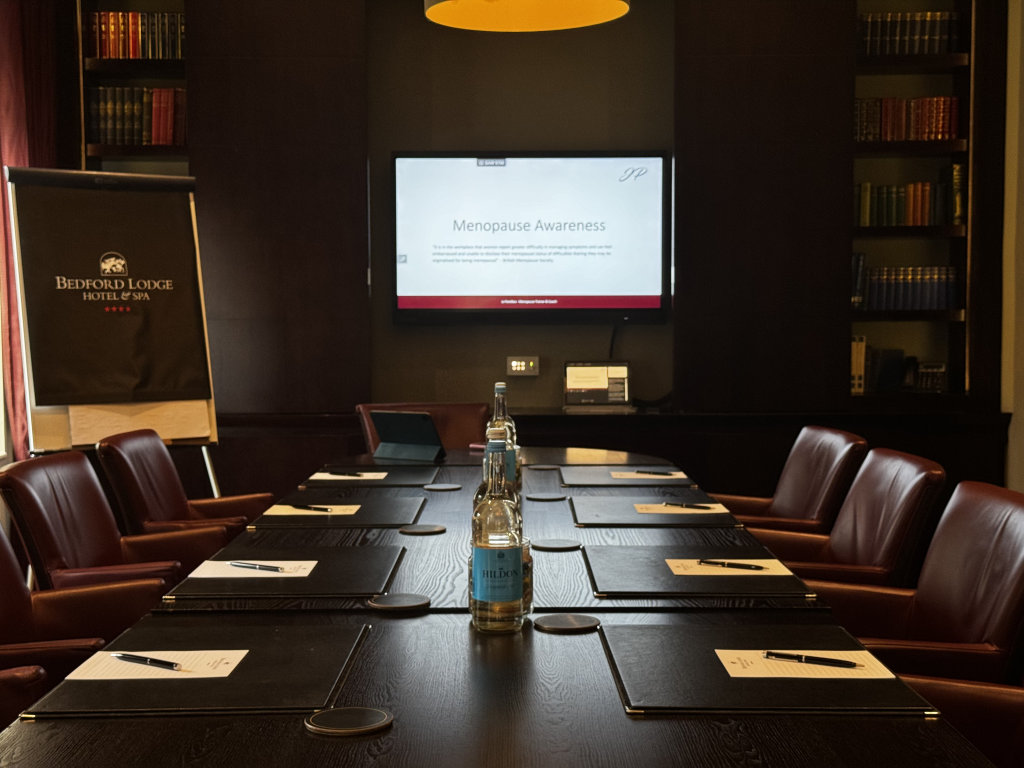 Jo Pontikos setting up a room ready for a menopause business seminar